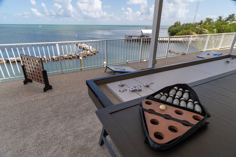 Giant Connect Four and a shuffleboard table on the deck