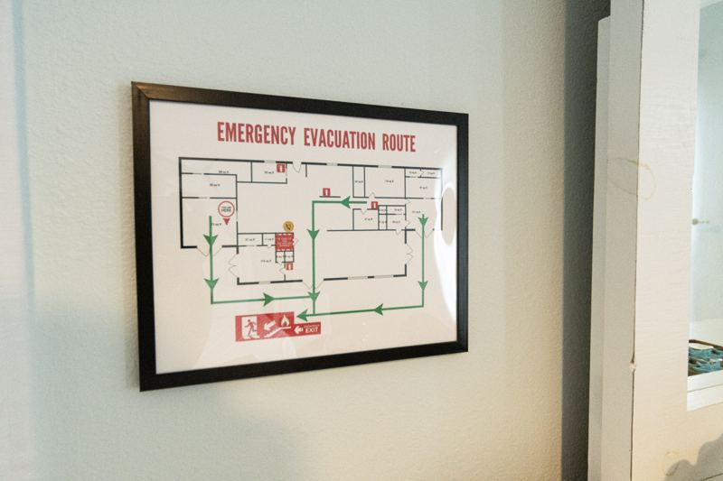 An emergency evacuation route sign on the wall