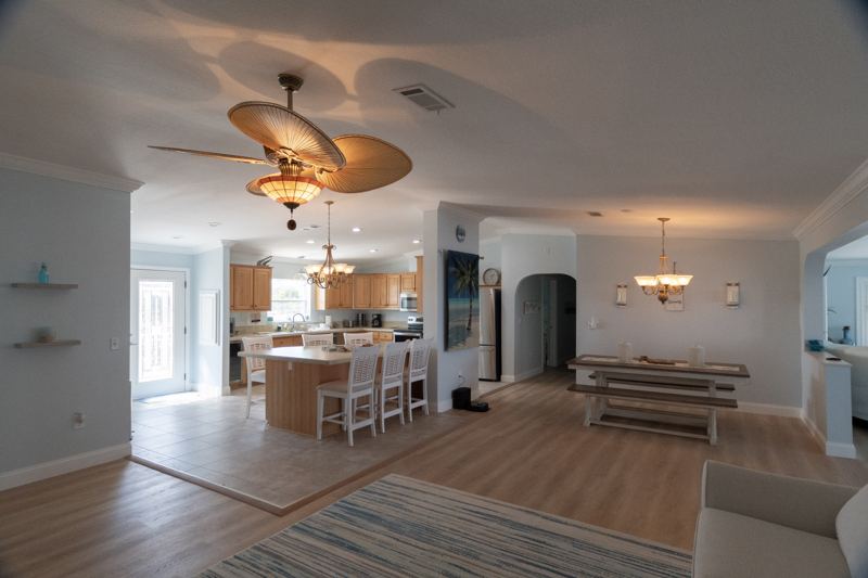 Open-plan kitchen, dining and living area at Dolphin Cove